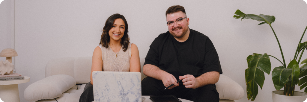 The Business Tea Co-Founders, Sarah and Ross Powell working on laptops in a relaxed environment
