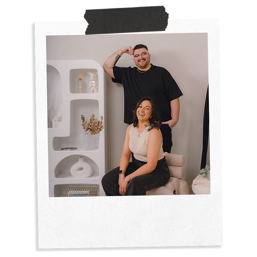 The Business Tea Co-Founders and siblings, Sarah and Ross Powell, stood in a studio environment, laughing to camera.