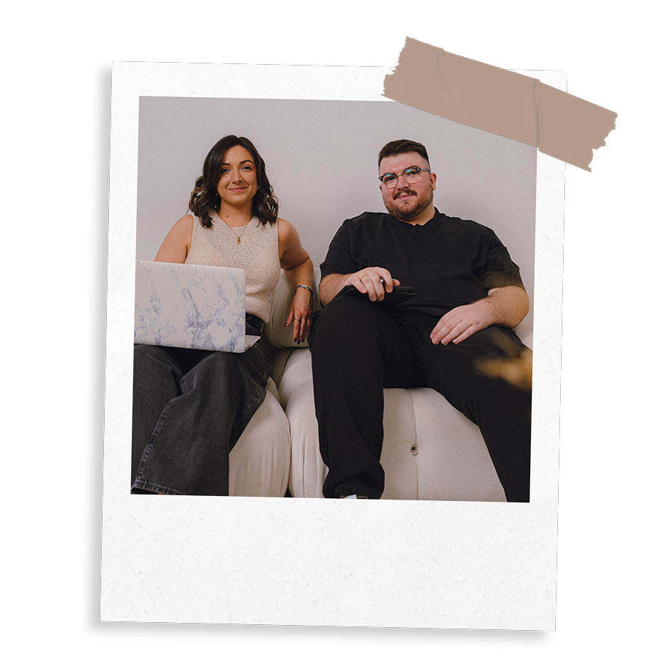 The Business Tea Sarah and Ross Powell sat on a sofa working on a laptop and iPad
