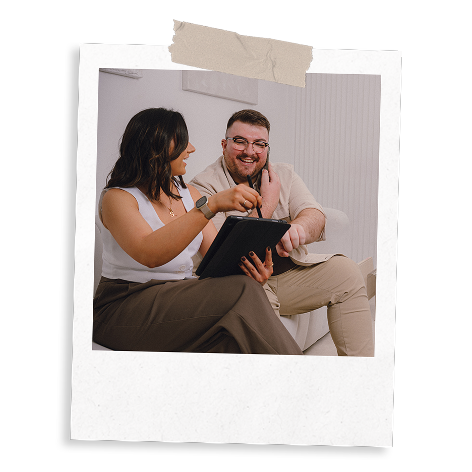 Sarah and Ross Powell, from The Business Tea, a digital marketing agency managing a client's social media accounts while providing positive news over the phone.