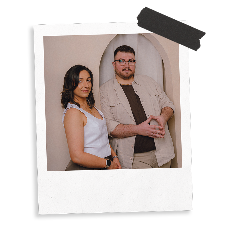 The Business Tea's Sarah and Ross Powell photographed against a beige background featuring an arch.