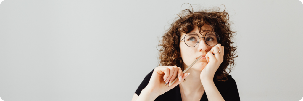 Marketing Manager pondering whether to hire a new marketing executive internally or hire externally through outsourced marketing support.